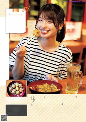 A woman sitting at a table with a bowl of food.