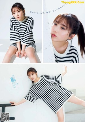 A woman laying on a bed in a blue and white striped shirt.