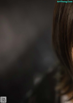 A close up of a woman's face with brown eyes.