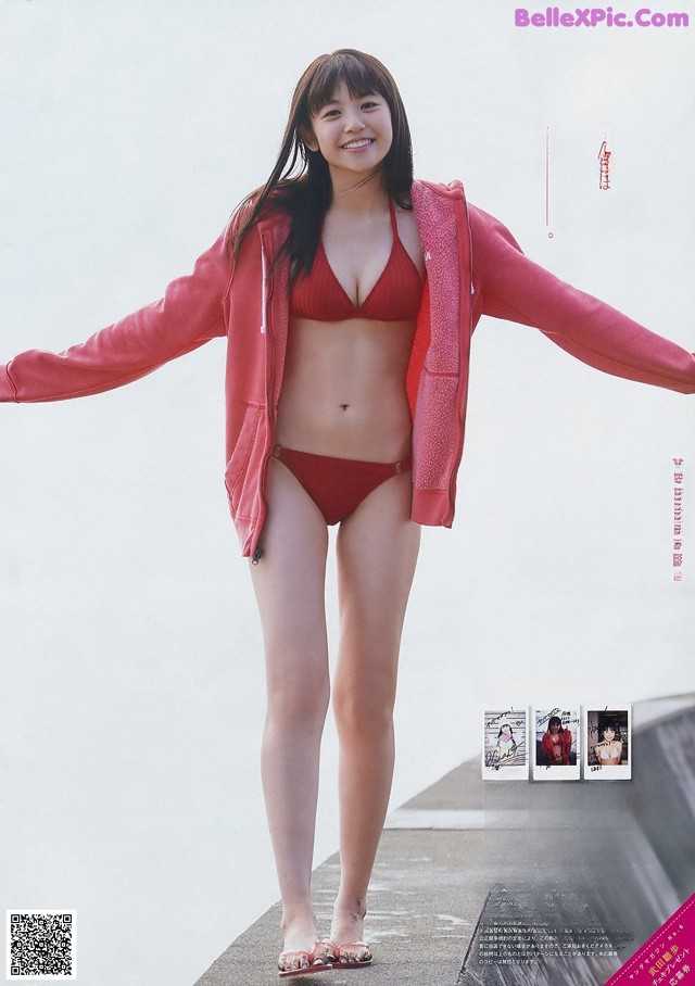 A woman in a red bikini posing for a magazine.