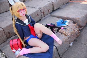 A woman in a school uniform with bunny ears and glasses.
