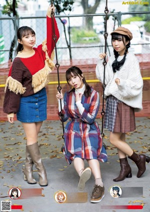 A group of women in kimonos posing for a picture.