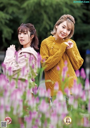 A group of women in kimonos posing for a picture.