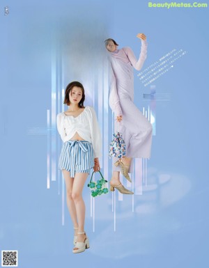 A couple of women standing next to each other on a blue background.