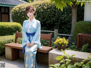 A woman in a kimono sitting on a bed.